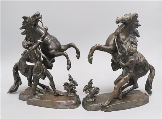 A pair of bronze Marly horses, signed Coustou height 27cm